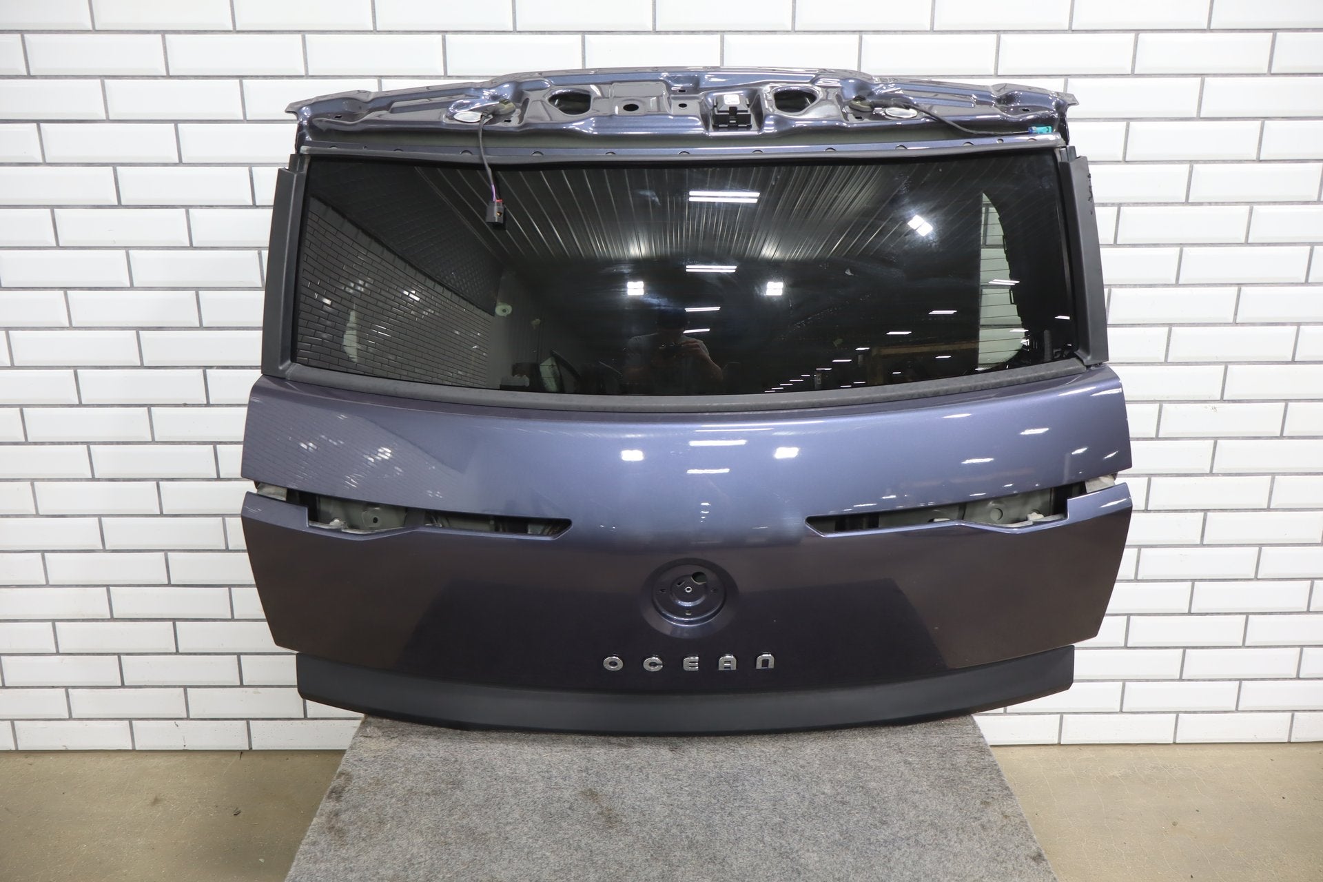 Used Fisker Ocean decklid hatch assembly in Mariana blue