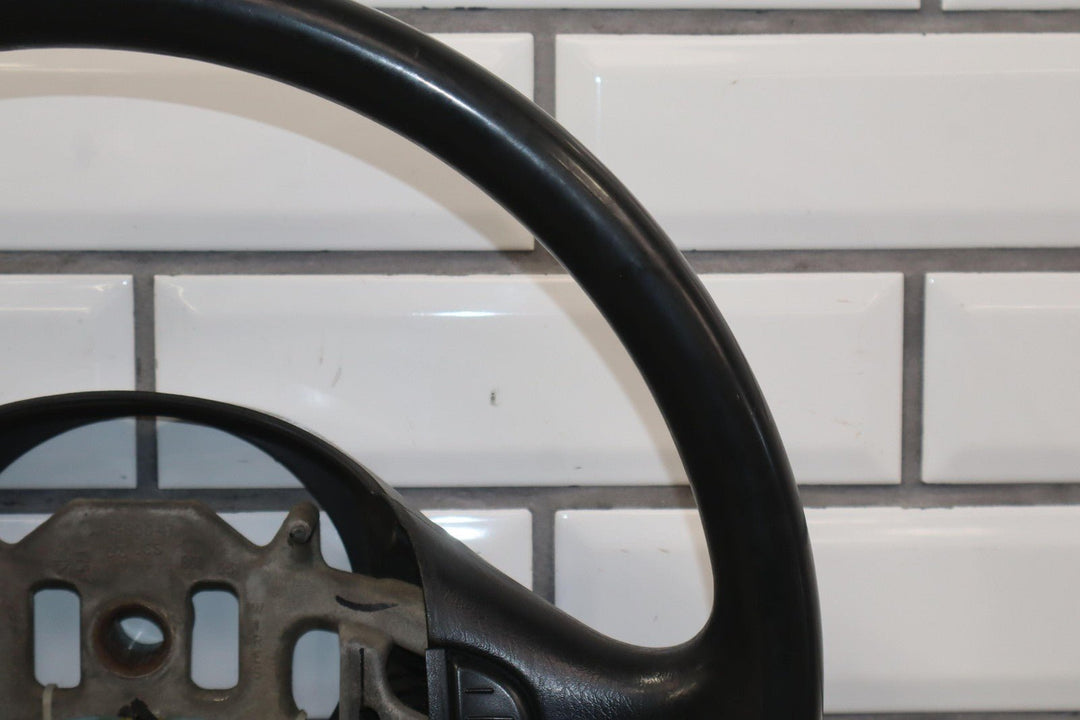 02 - 04 Ford F250 Super Duty Black Vinyl Steering Wheel with Cruise Control