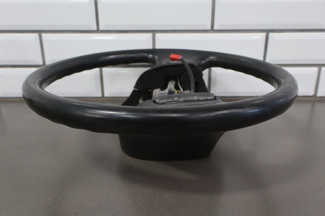 02 - 04 Ford F250 Super Duty Black Vinyl Steering Wheel with Cruise Control