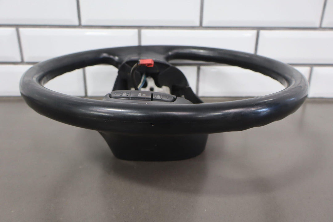 02 - 04 Ford F250 Super Duty Black Vinyl Steering Wheel with Cruise Control