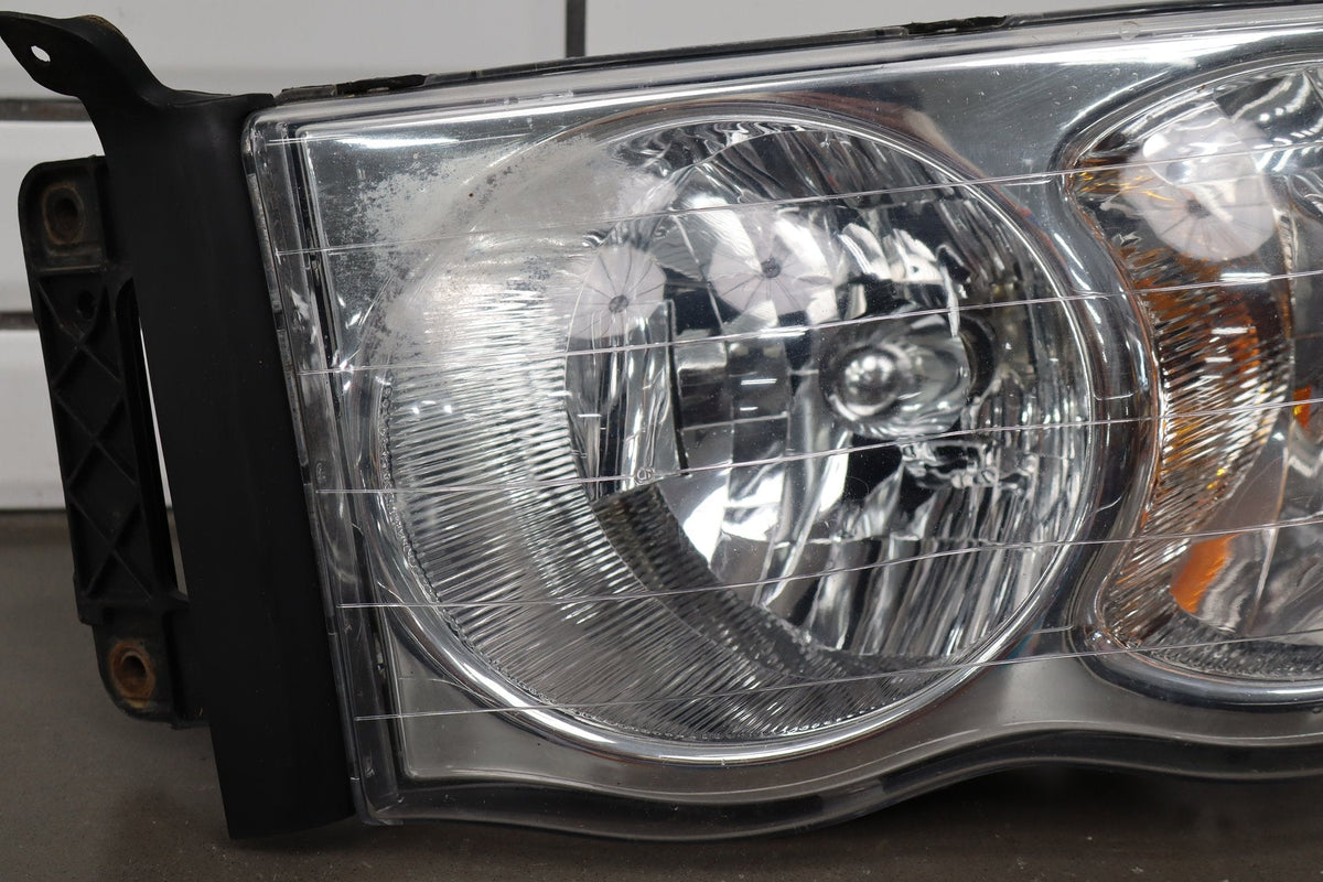 02-05 Dodge Ram LH Headlight OEM 55077121AG