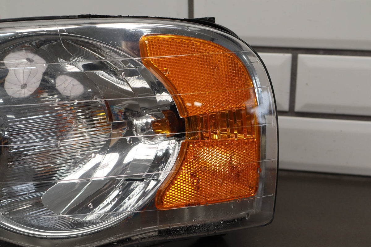 02-05 Dodge Ram LH Headlight OEM 55077121AG