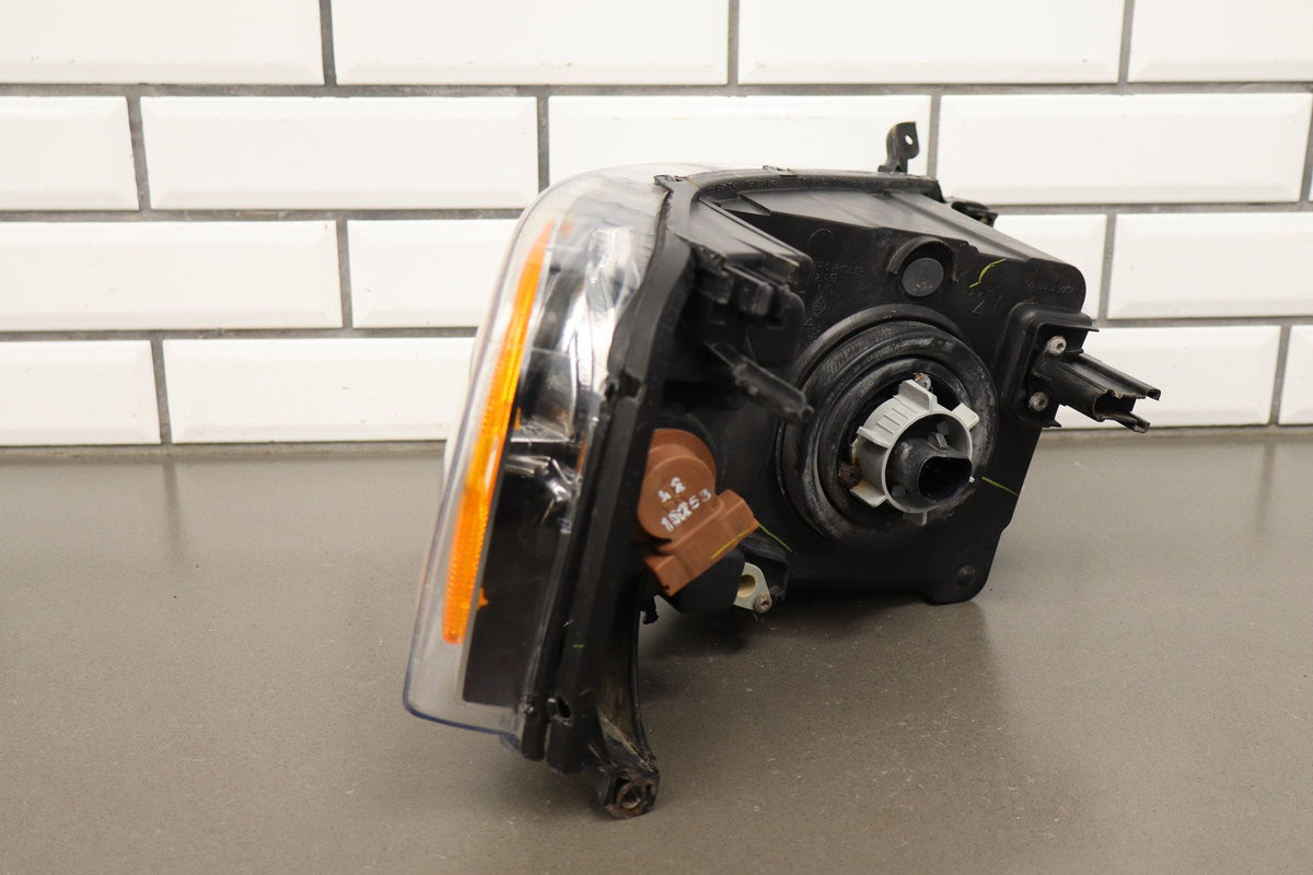 02-05 Dodge Ram LH Headlight OEM 55077121AG