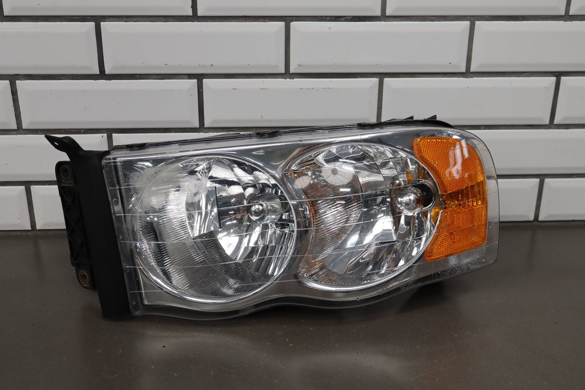02-05 Dodge Ram LH Headlight OEM 55077121AG