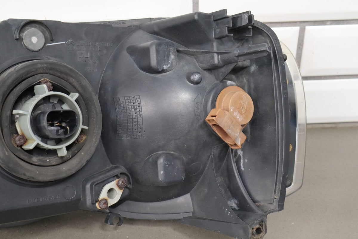 02-05 Dodge Ram RH Headlight OEM 55077120AG