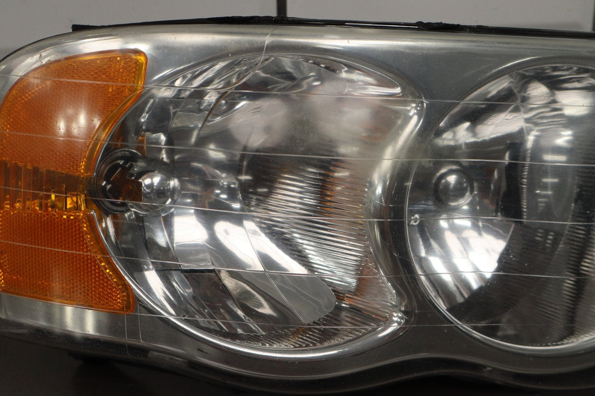 02-05 Dodge Ram RH Headlight OEM 55077120AG