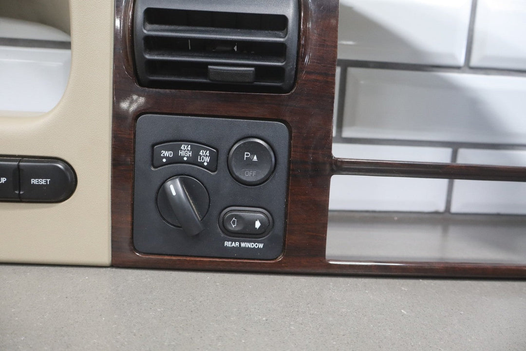 05 to 07 Ford F250 F350 SD Dash Cluster Radio Bezel Trim Panel Wood Grain OEM