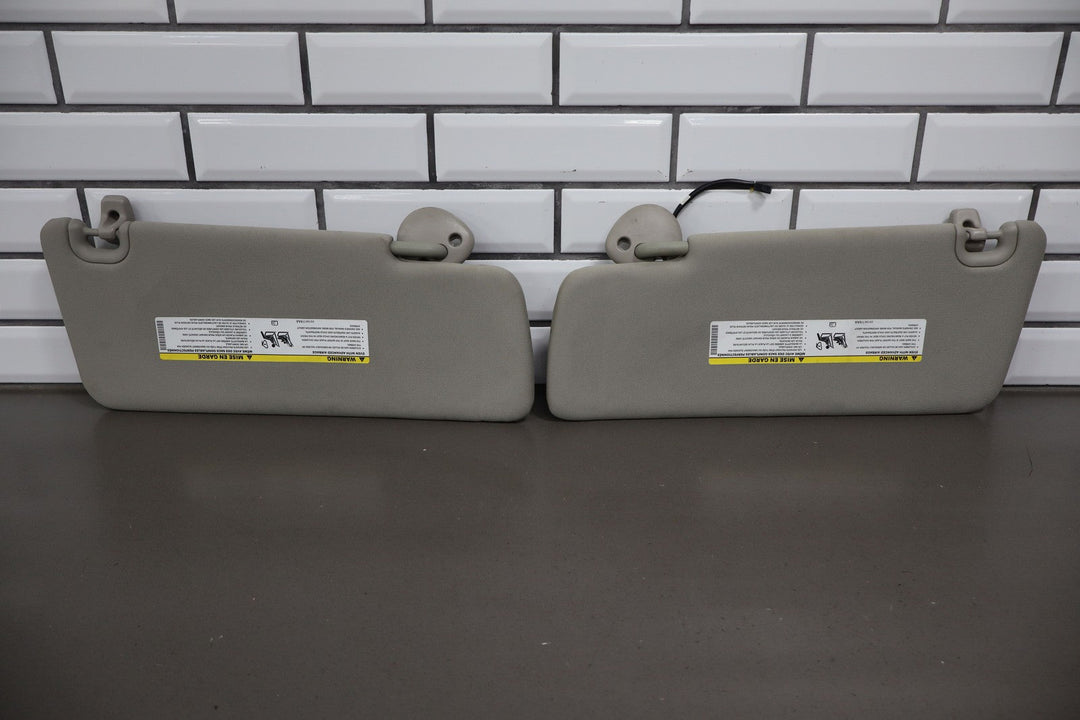 15 - 18 Ram OEM Interior Sun Visors Pair Left / Right Neutral Illuminated