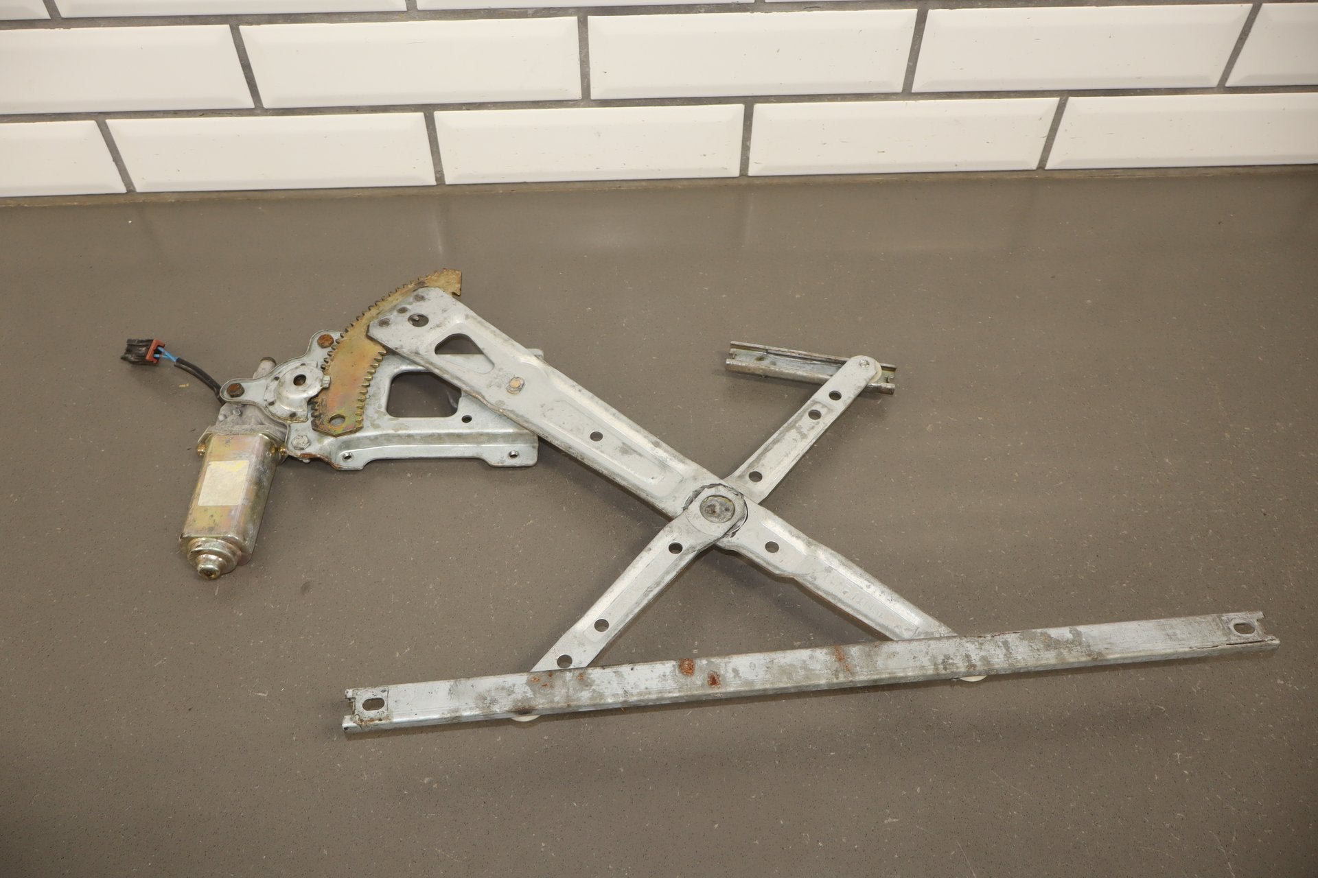 1986 Nissan 300ZX Left Front Door Regulator OEM