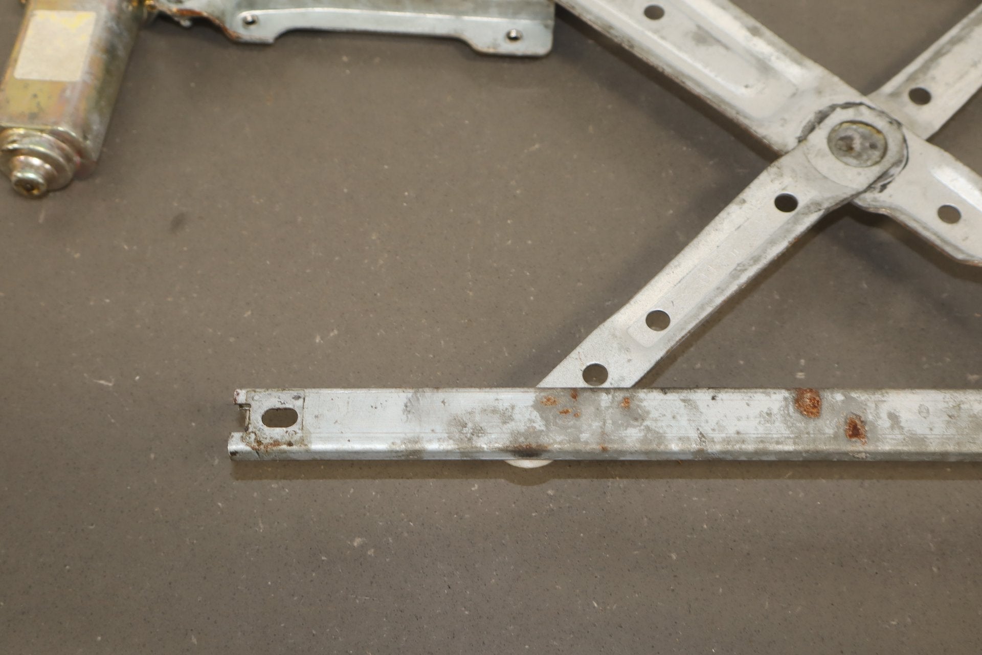 1986 Nissan 300ZX Left Front Door Regulator OEM