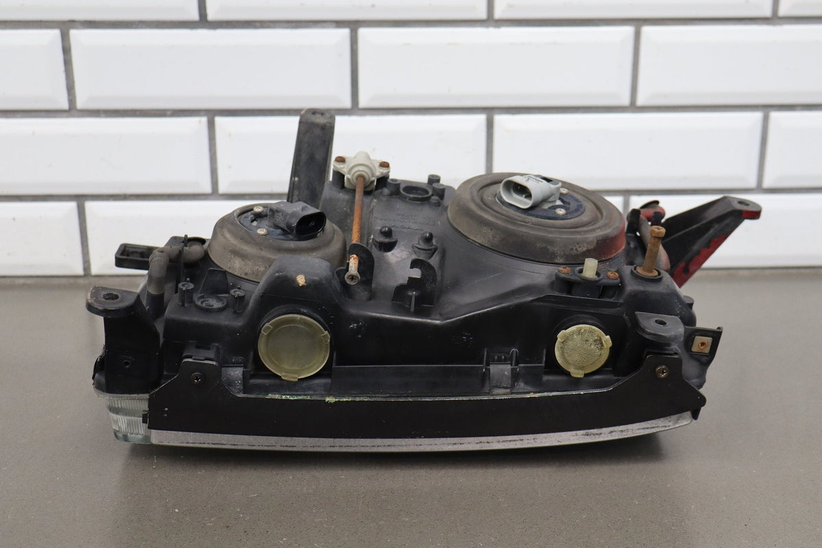 1991-1995 Toyota Land Cruiser Left Headlamp 8111060394