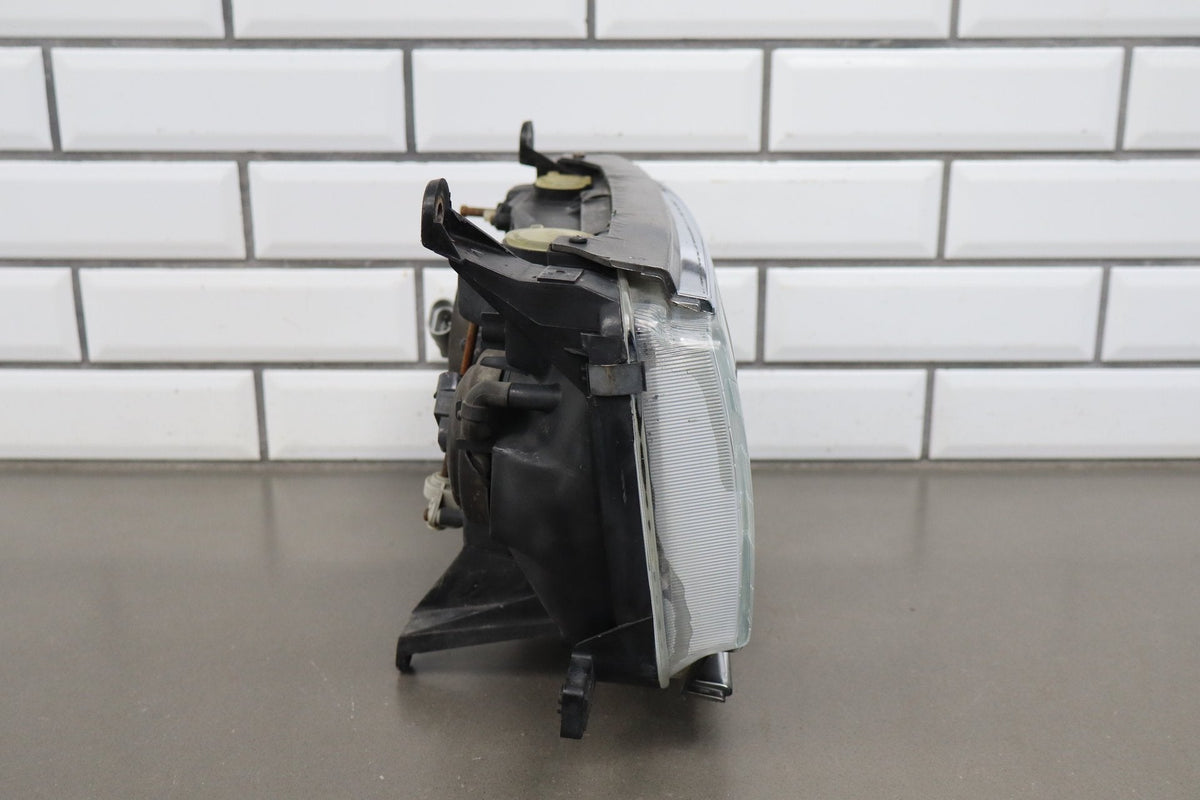 1991-1995 Toyota Land Cruiser Left Headlamp 8111060394