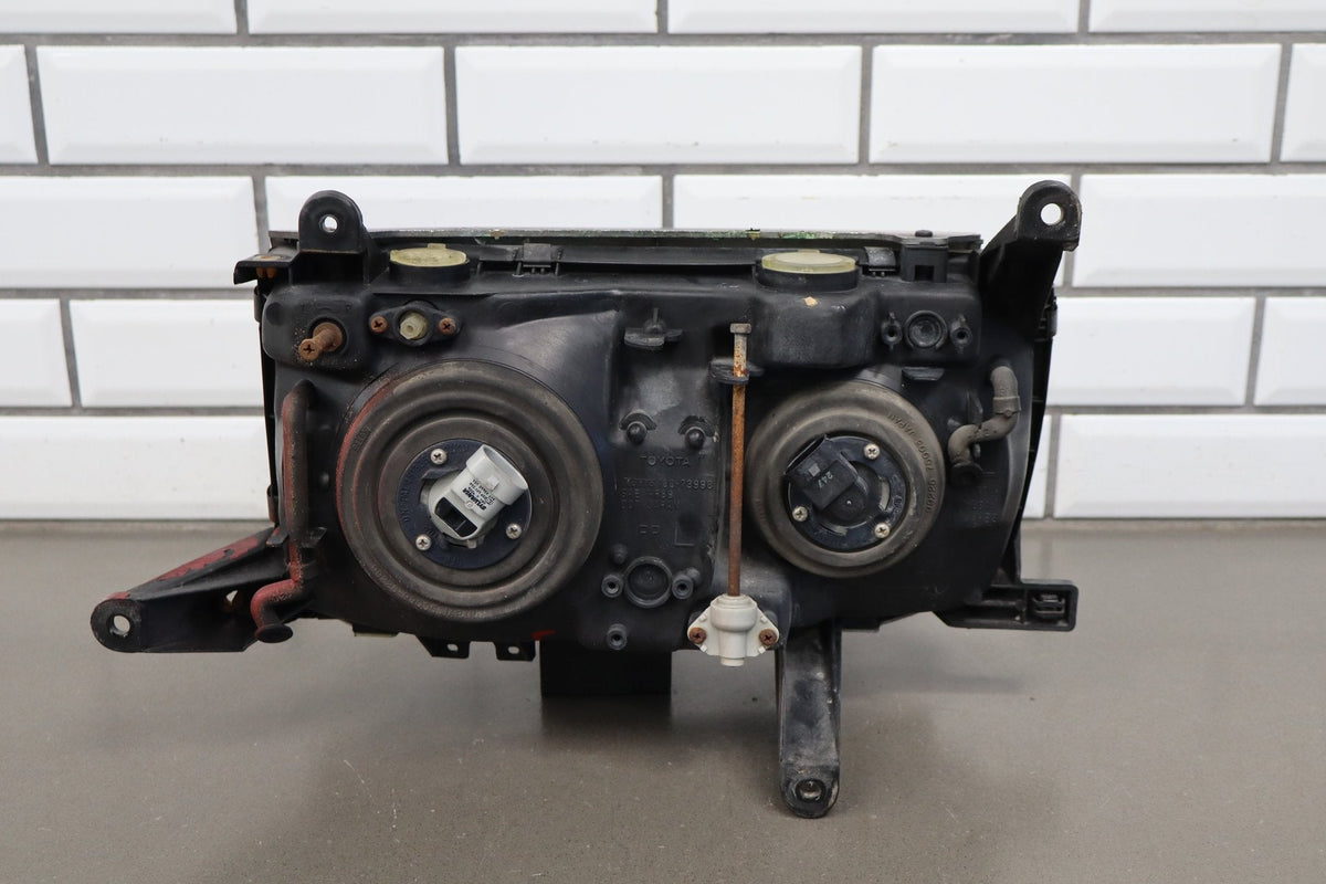 1991-1995 Toyota Land Cruiser Left Headlamp 8111060394