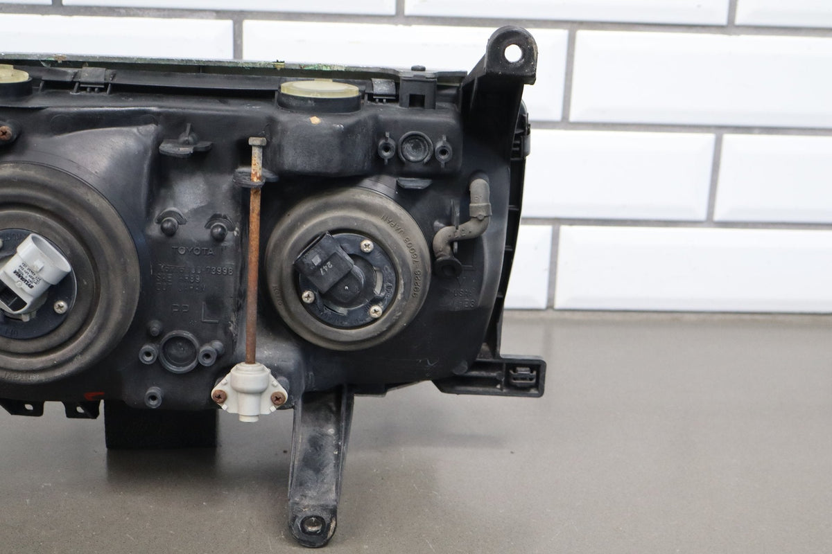 1991-1995 Toyota Land Cruiser Left Headlamp 8111060394