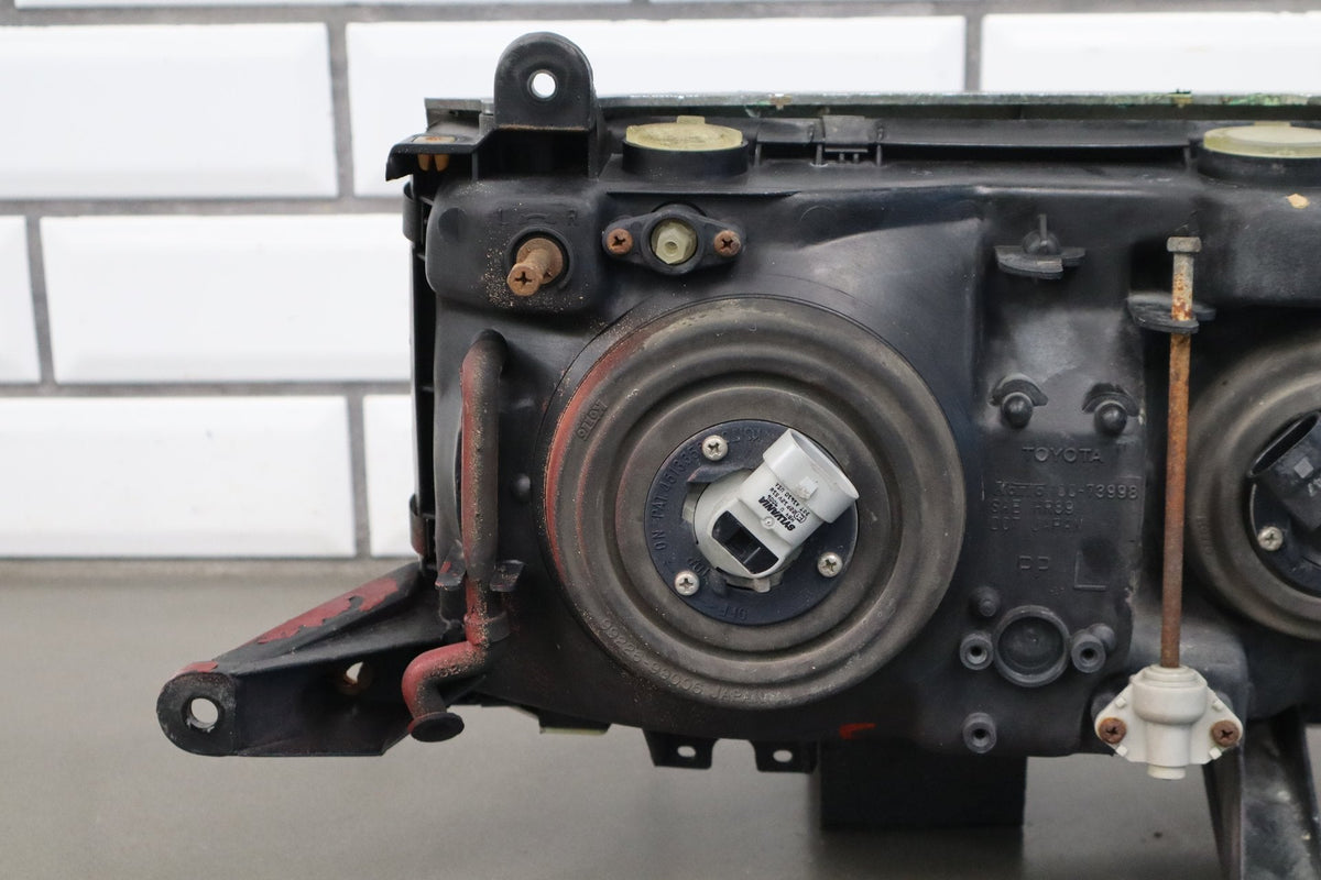 1991-1995 Toyota Land Cruiser Left Headlamp 8111060394
