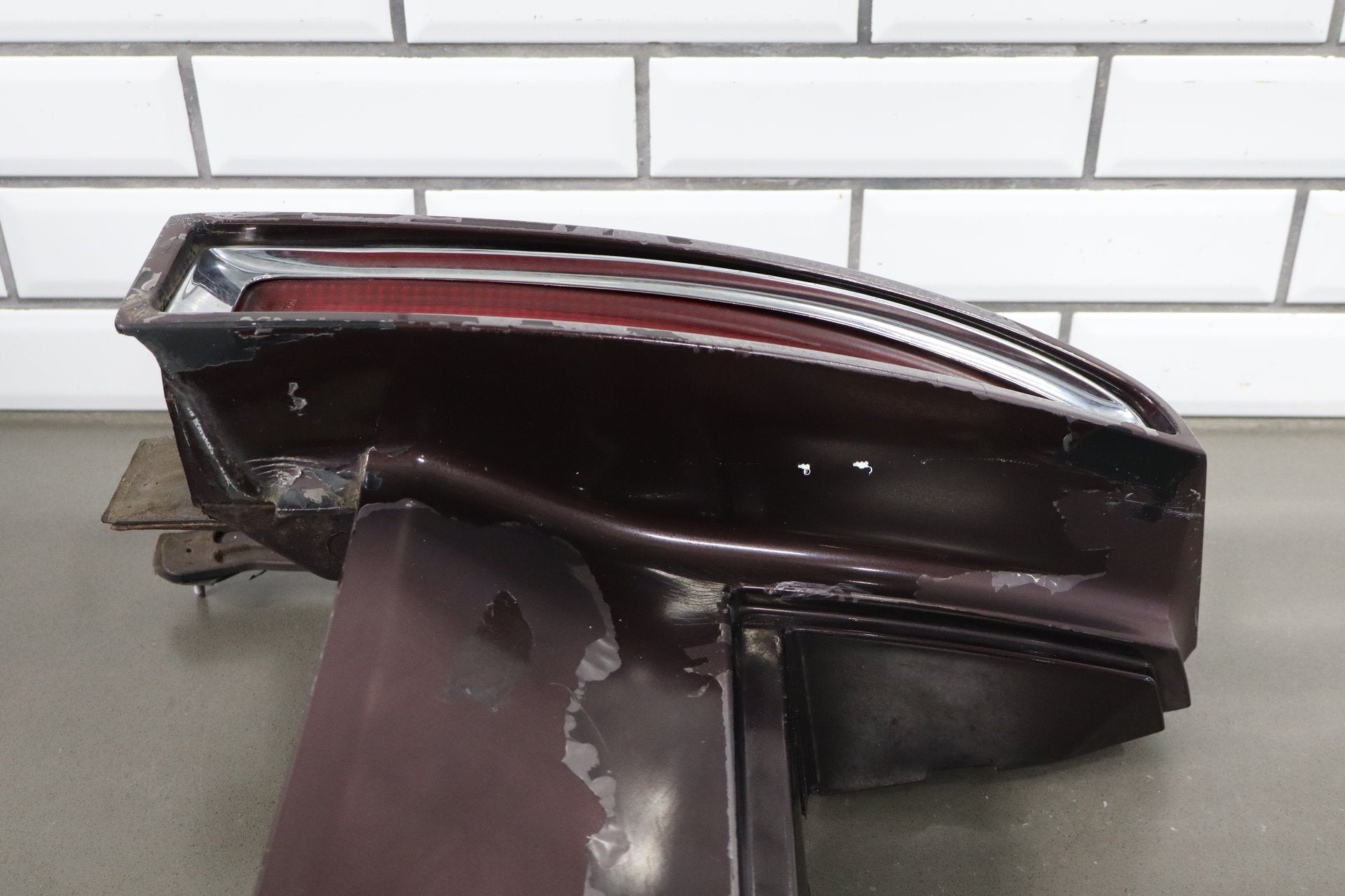 1993-1996 Cadillac Fleetwood Left Tail Light W/ Filler Panel Dark Cherry 77