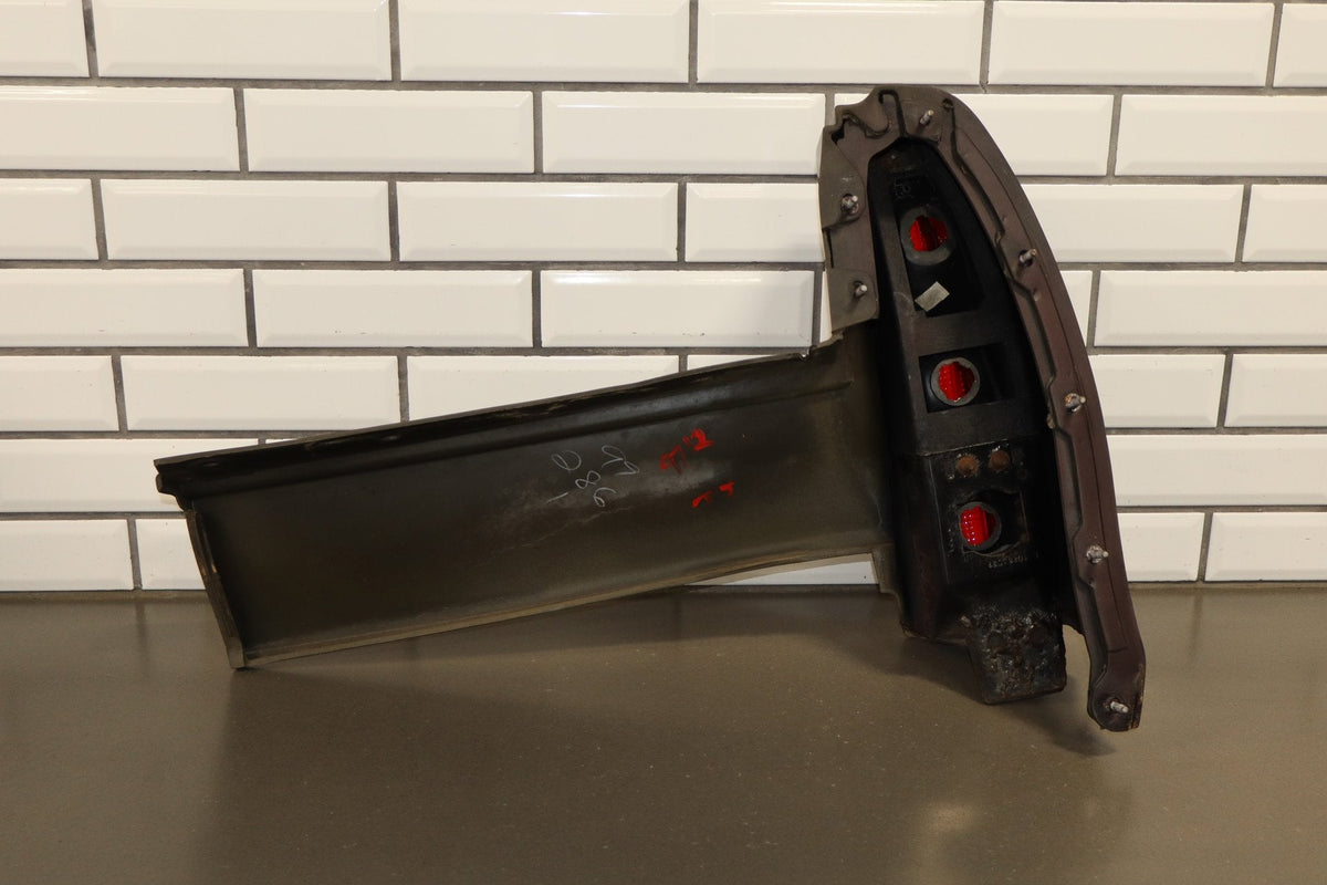 1993-1996 Cadillac Fleetwood Left Tail Light W/ Filler Panel Dark Cherry 77