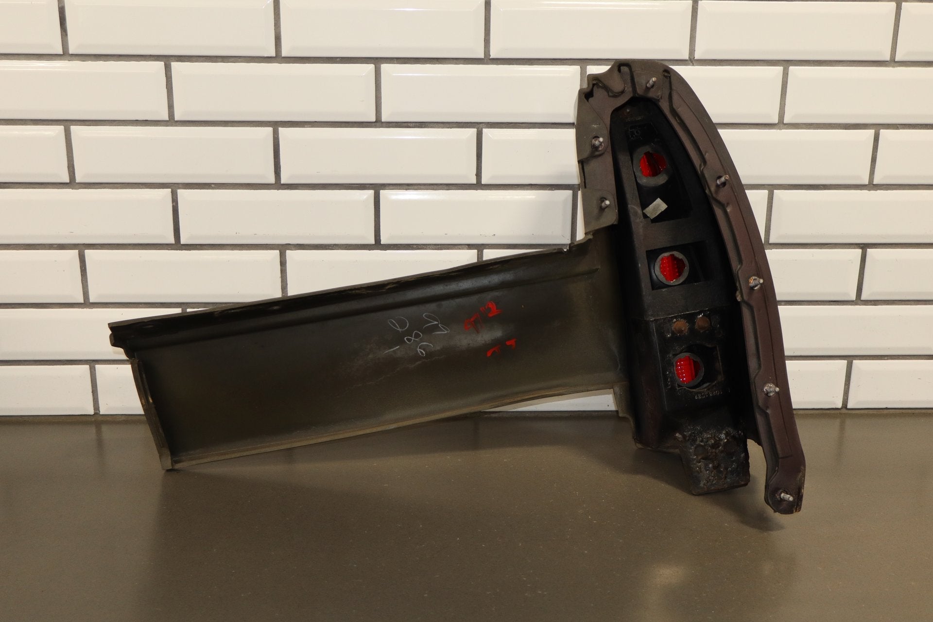 1993-1996 Cadillac Fleetwood Left Tail Light W/ Filler Panel Dark Cherry 77