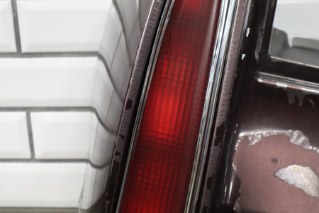 1993-1996 Cadillac Fleetwood Left Tail Light W/ Filler Panel Dark Cherry 77
