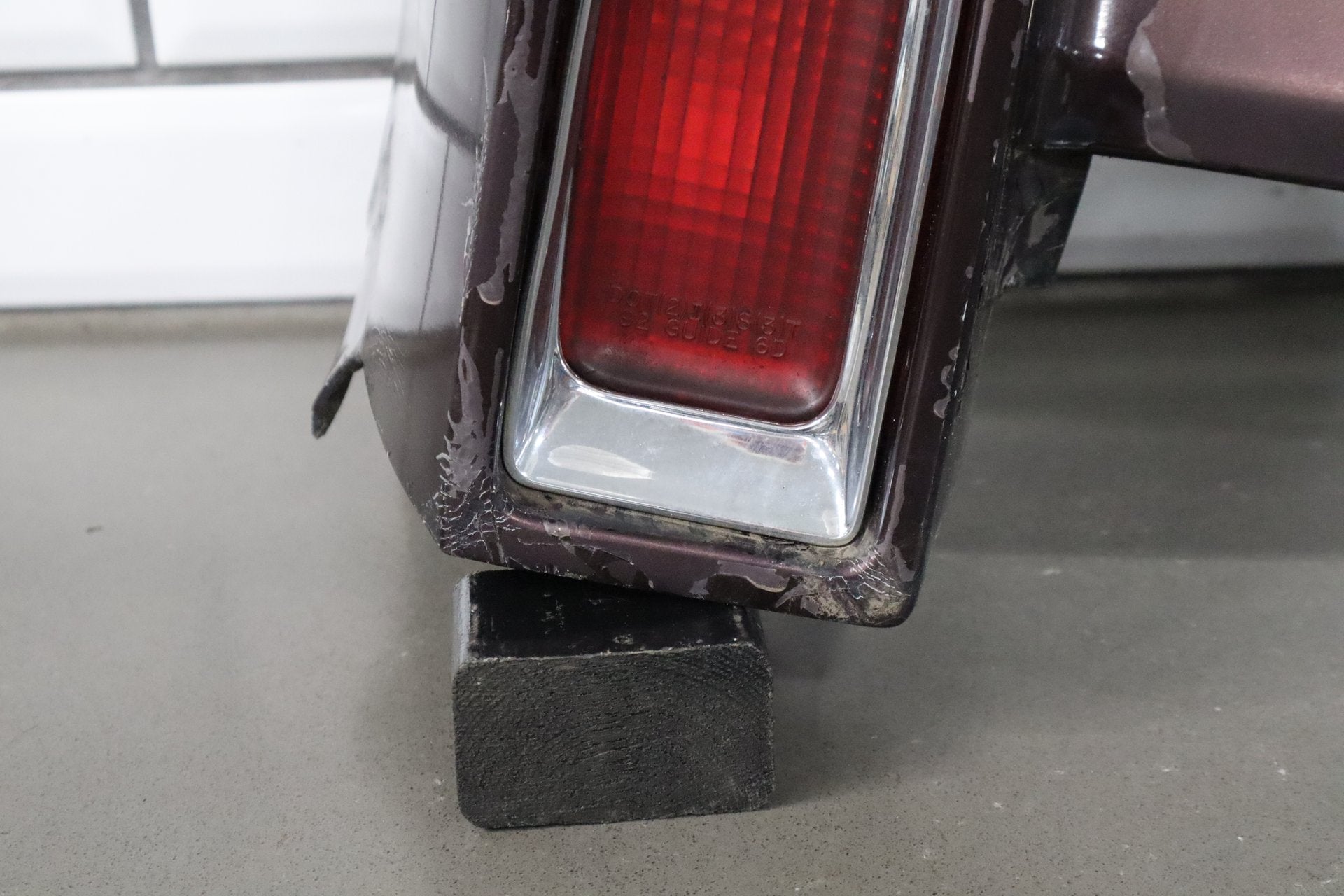 1993-1996 Cadillac Fleetwood Left Tail Light W/ Filler Panel Dark Cherry 77
