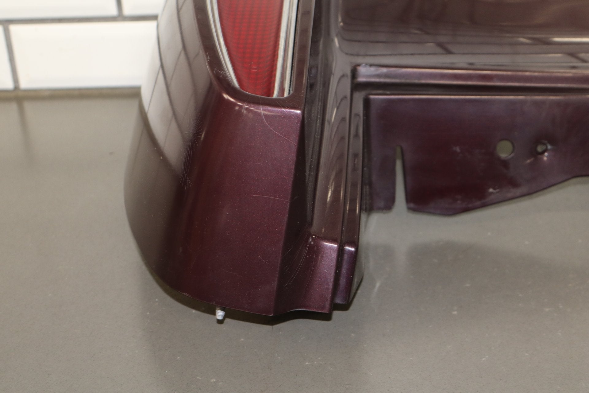 1993-1996 Cadillac Fleetwood Right Tail Light W/ Filler Panel Dark Cherry 77