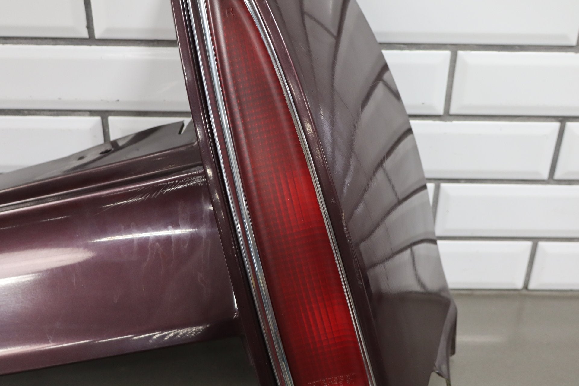 1993-1996 Cadillac Fleetwood Right Tail Light W/ Filler Panel Dark Cherry 77