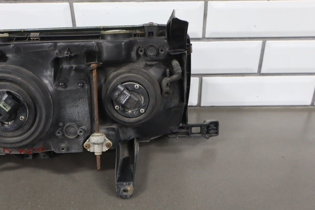1995 - 1998 Toyota Land Cruiser Left Headlamp W/Chrome Trim 8111060395