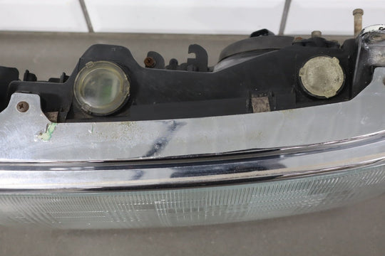 1995 - 1998 Toyota Land Cruiser Left Headlamp W/Chrome Trim 8111060395