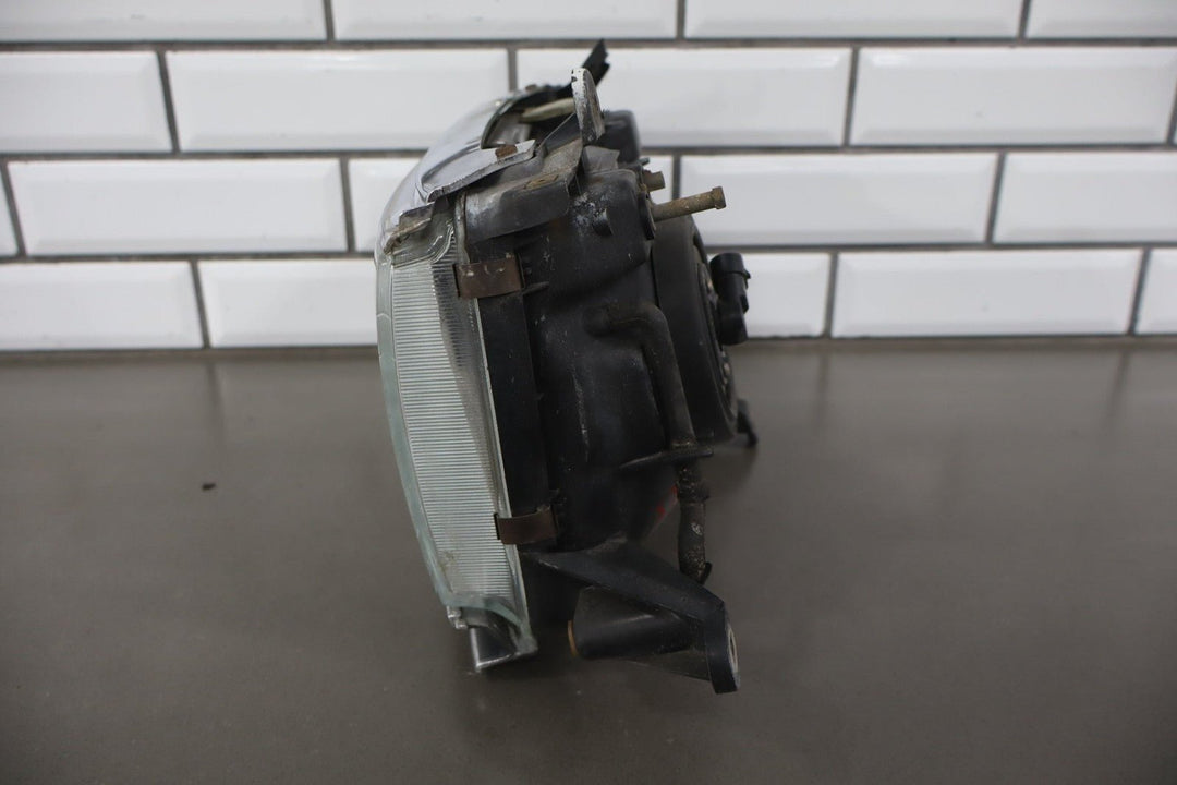 1995 - 1998 Toyota Land Cruiser Left Headlamp W/Chrome Trim 8111060395