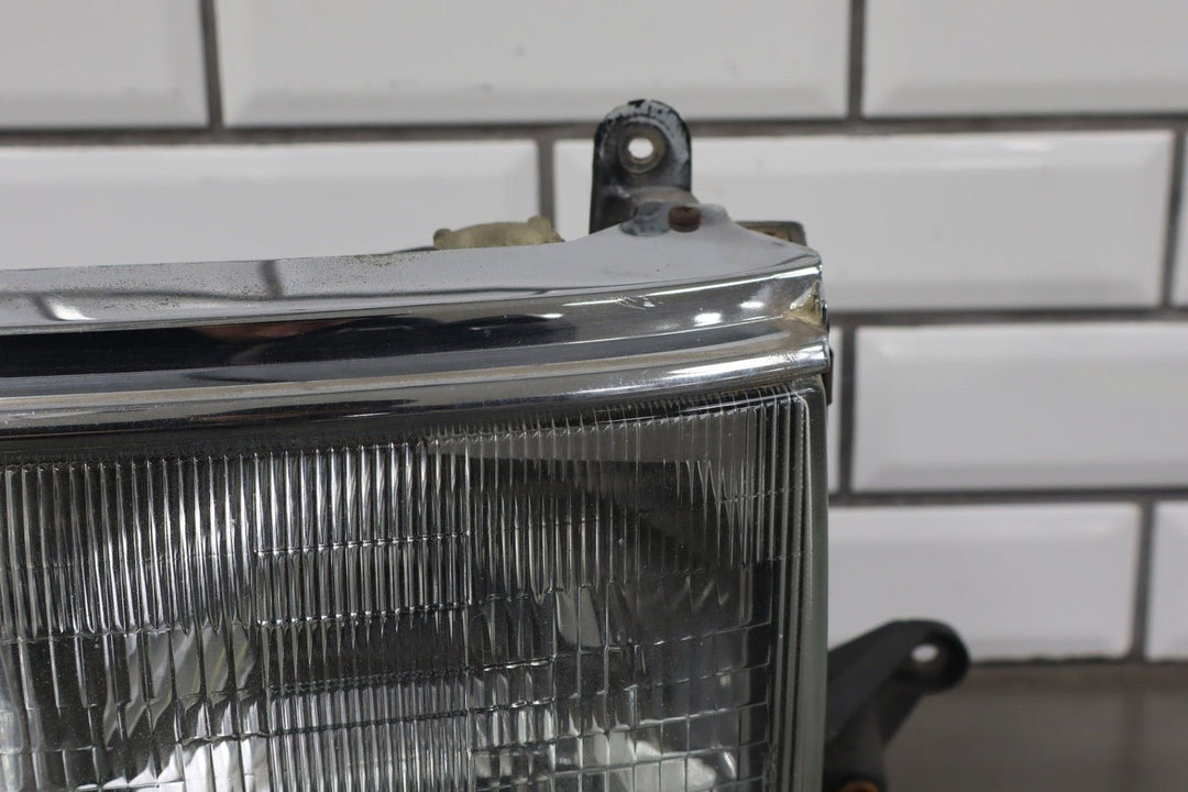 1995 - 1998 Toyota Land Cruiser Left Headlamp W/Chrome Trim 8111060395