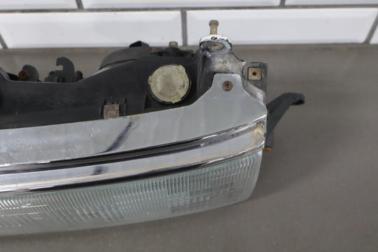 1995 - 1998 Toyota Land Cruiser Left Headlamp W/Chrome Trim 8111060395