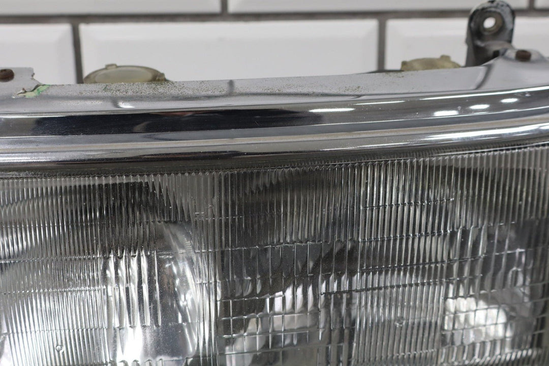 1995 - 1998 Toyota Land Cruiser Left Headlamp W/Chrome Trim 8111060395