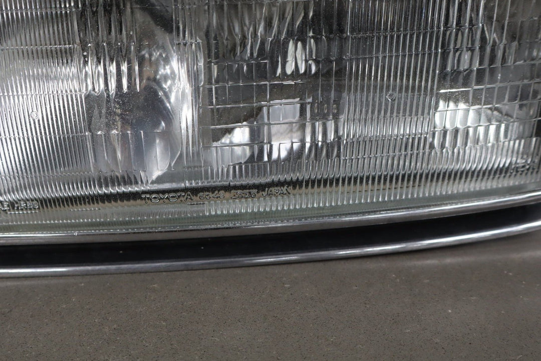 1995 - 1998 Toyota Land Cruiser Left Headlamp W/Chrome Trim 8111060395
