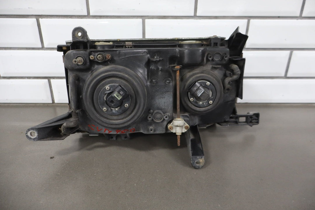 1995 - 1998 Toyota Land Cruiser Left Headlamp W/Chrome Trim 8111060395