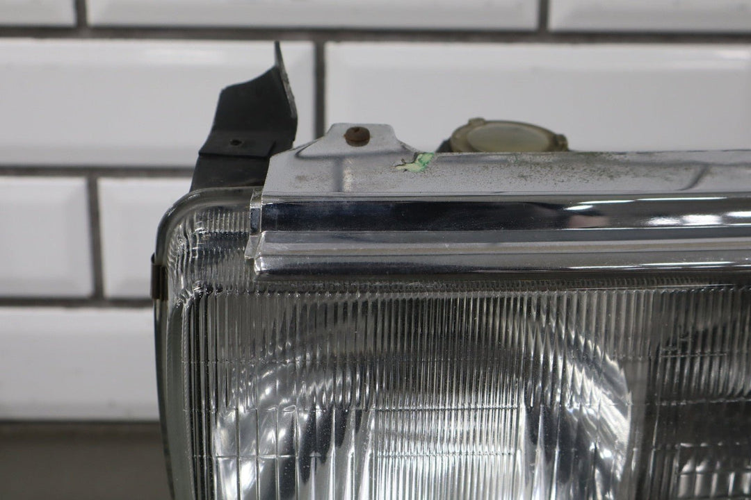1995 - 1998 Toyota Land Cruiser Left Headlamp W/Chrome Trim 8111060395