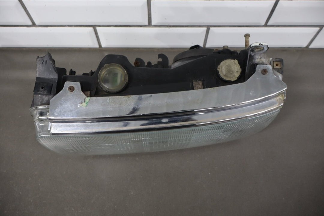 1995 - 1998 Toyota Land Cruiser Left Headlamp W/Chrome Trim 8111060395