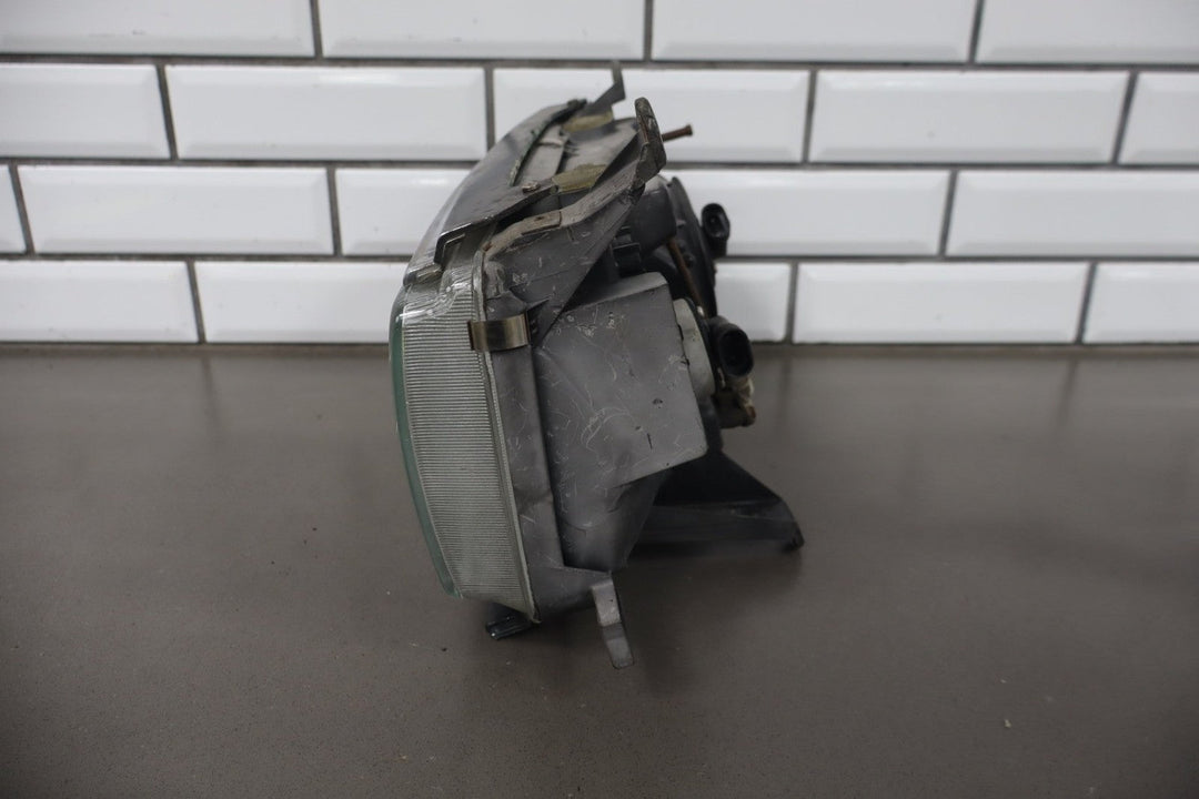 1995 - 1998 Toyota Land Cruiser Right Headlamp W/Chrome Trim 8111060395 OEM