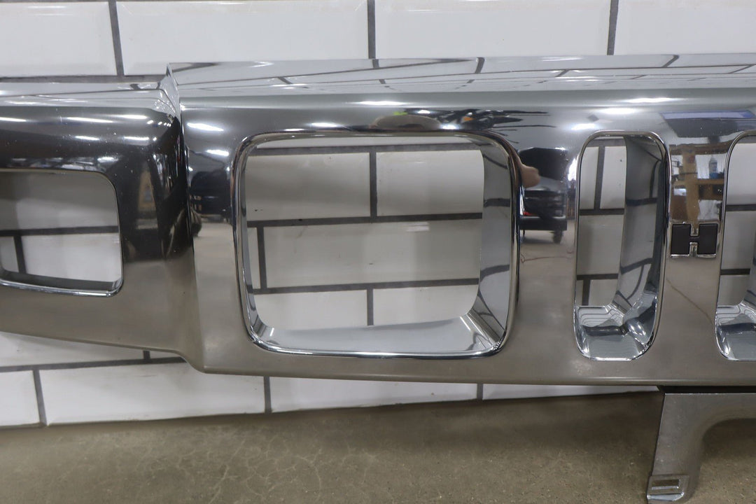 2003 - 2007 Hummer H2 OEM Upper Headlight Bumper Chrome Grille *1 Broken Tab*
