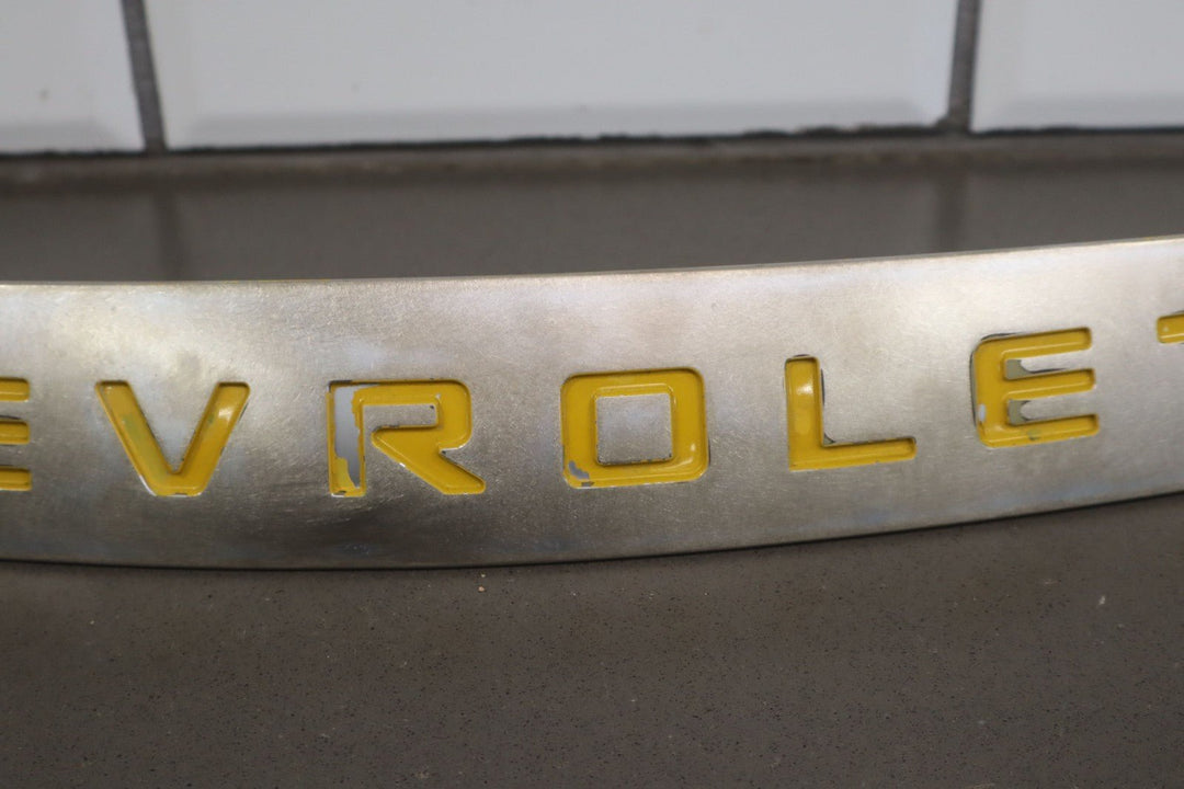 2004 - 2006 Chevy SSR OEM Satin Nose Trim Emblem W/Yellow Letters