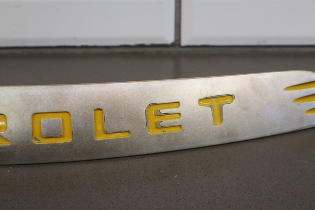 2004 - 2006 Chevy SSR OEM Satin Nose Trim Emblem W/Yellow Letters