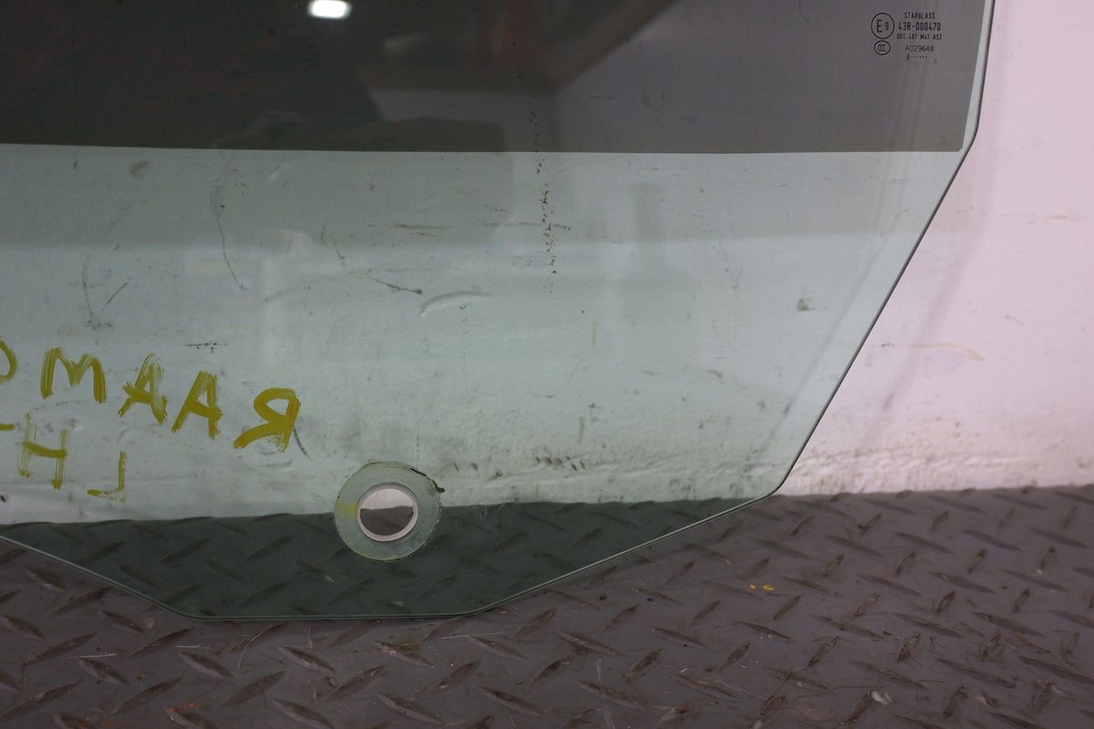 2010 ASTON- Left Front Door Window
