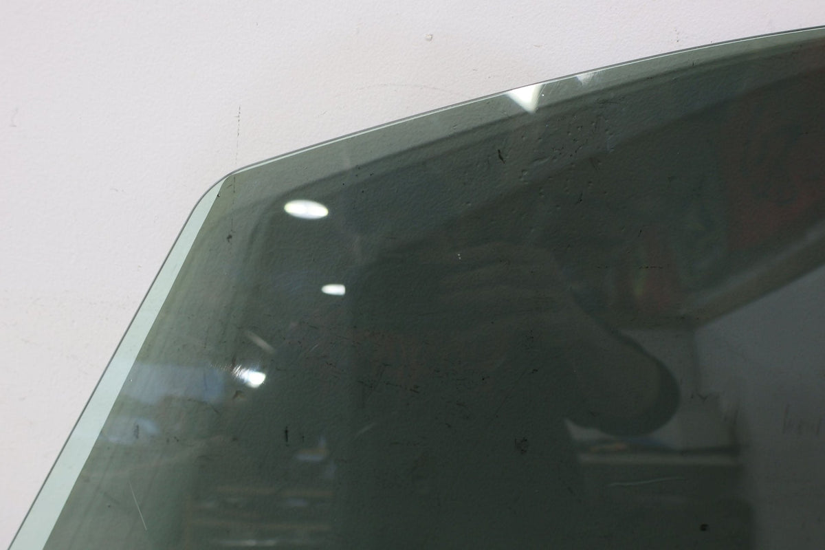 2010 ASTON- Left Front Door Window