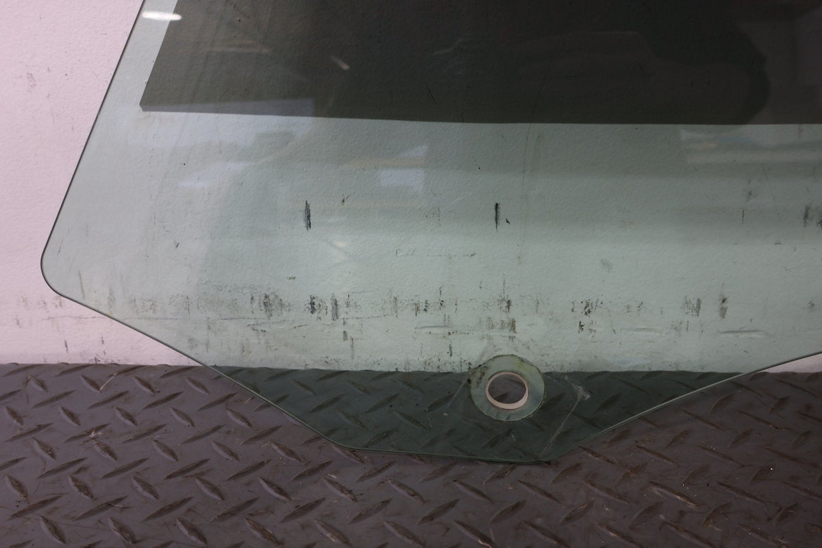 2010 ASTON- Left Front Door Window