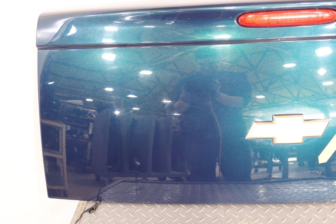 03-06 Chevy SSR Rear Tail Gate (Aqua Blur Metallic 26U)Paint Damage Below Emblem