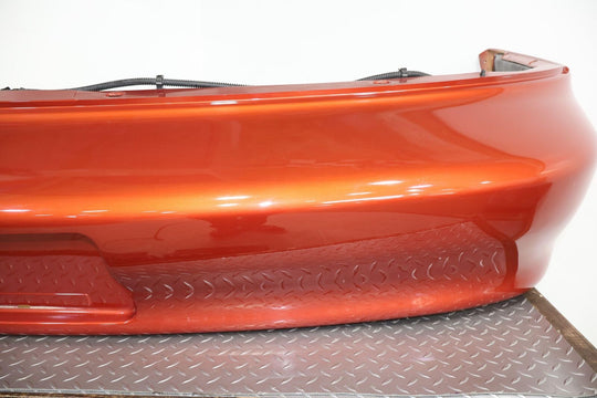 98-02 Chevy Camaro Z28 Rear OEM Bumper W/Corner Lights (Sunset Orange Metallic)