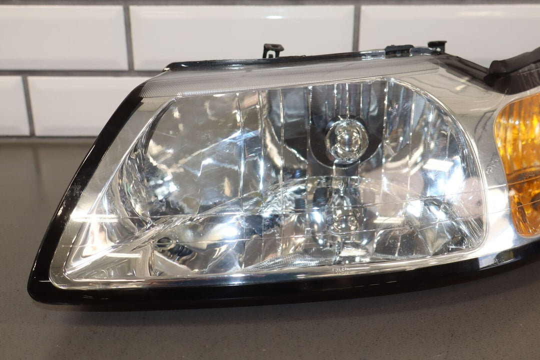 99-04 Ford Mustang TYC Aftermarket Headlight Pair (Left / Right) Clean Lenses