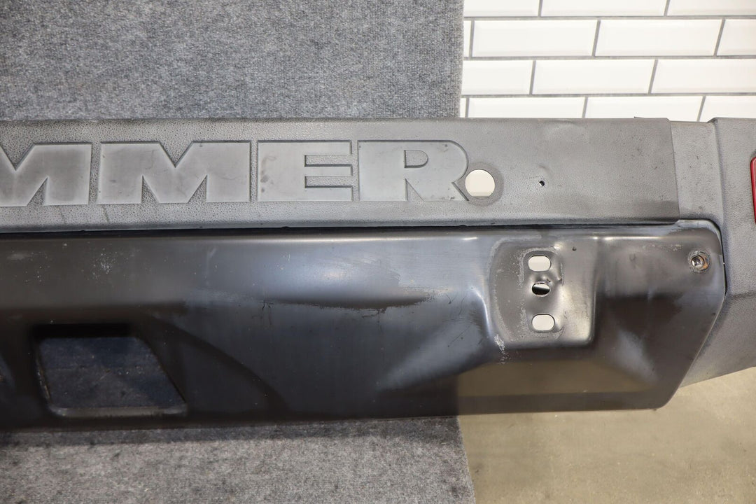 06-07 Hummer H2 SUV OEM Rear Bumper Bar W/Tail Light End Caps (Textured Black)