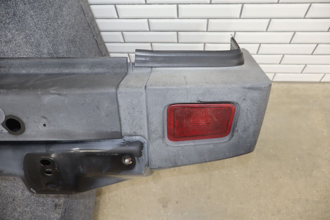 06-07 Hummer H2 SUV OEM Rear Bumper Bar W/Tail Light End Caps (Textured Black)