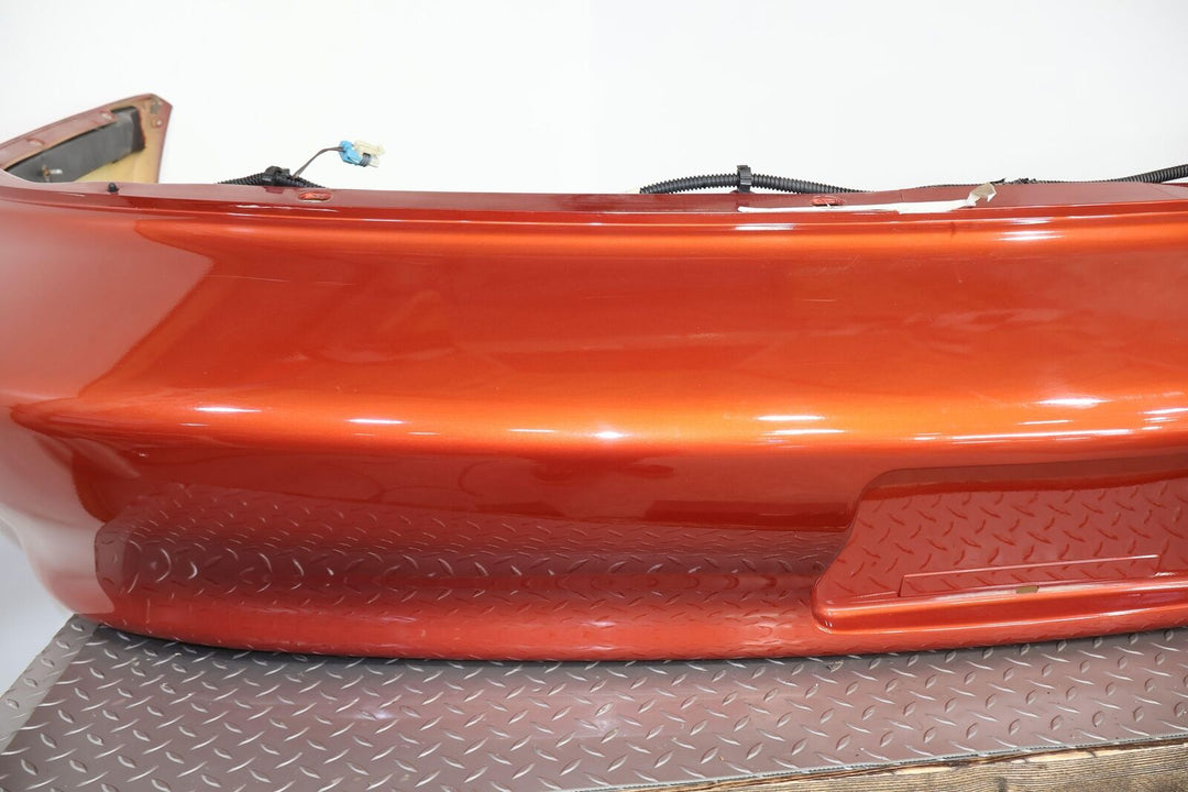 98-02 Chevy Camaro Z28 Rear OEM Bumper W/Corner Lights (Sunset Orange Metallic)