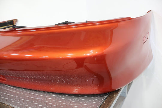 98-02 Chevy Camaro Z28 Rear OEM Bumper W/Corner Lights (Sunset Orange Metallic)